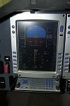 Pilot's PFD and stowed control keyboard.  Most functions on the PFD are controlled via soft keys and knobs.  
