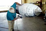 George Fricke, our itinerant aircraft painter, brings his mobile shop to Castle.  We repair and repaint the tip tanks, polish their tips, and restore original Tactical Air Command markings.  