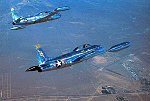 N9124Z in formation with Dan Lavigna's Canadair CT-133 over Mojave, California, near &quotThe Center.&quot  Note Mojave Airport below.  <br><br>Copyright 2000 by Ted Carlson.  