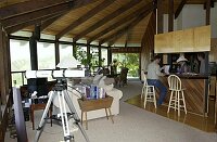 Main living, dining, kitchen area.  The windows all look out to the ocean over the hills.  