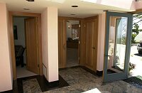 Main foyer, showing doors to the master bedroom (right) and guest room (left).  