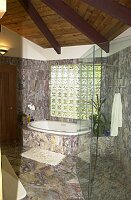 Another view of the master bath.  The structural glass on the righthand side of the picture is the large, walk-in shower area.  I've always loved showers like this, with no doors, just a large open space to walk into.  Also nice to jump between the hot Jacuzzi and a cooling shower.  Life's rough...