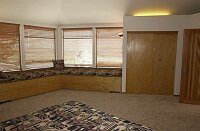 More of the master bedroom, showing an additional closet and the one of the double entrance doors.  <br><br>Of course, the windows look out on the spectacular views...