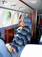Margaret snoozes on our first leg down to Loreto, in southern Baja, using the new cabin blanket to keep warm.  