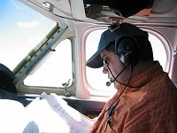 John studies our plans during the flight from San Carlos, CA, to Loreto, BCS, Mexico.  