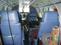 En-route to Belize, the cabin is filled up with flight planning gear, snacks, and reading material.  