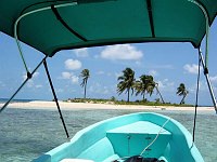 Nearing the reef, we stopped at this small atoll for a snorkel and lunch.  When we arrived, we were the only ones there.  But by the time we finished snorkeling, two other boats had arrived with a crowd, everyone wanting to use the fire pit for cooking lunch.  