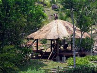 Workmen building a new outdoor pavillion as part of a new pool/hot tub center.  